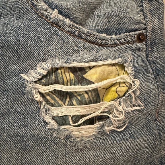 We the Free denim shorts. Frayed hem with floral details in distressed areas. - Picture 4 of 5